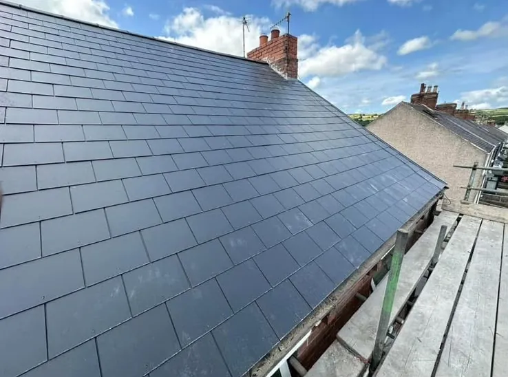 Newly laid slate pitched roof on a terraced house