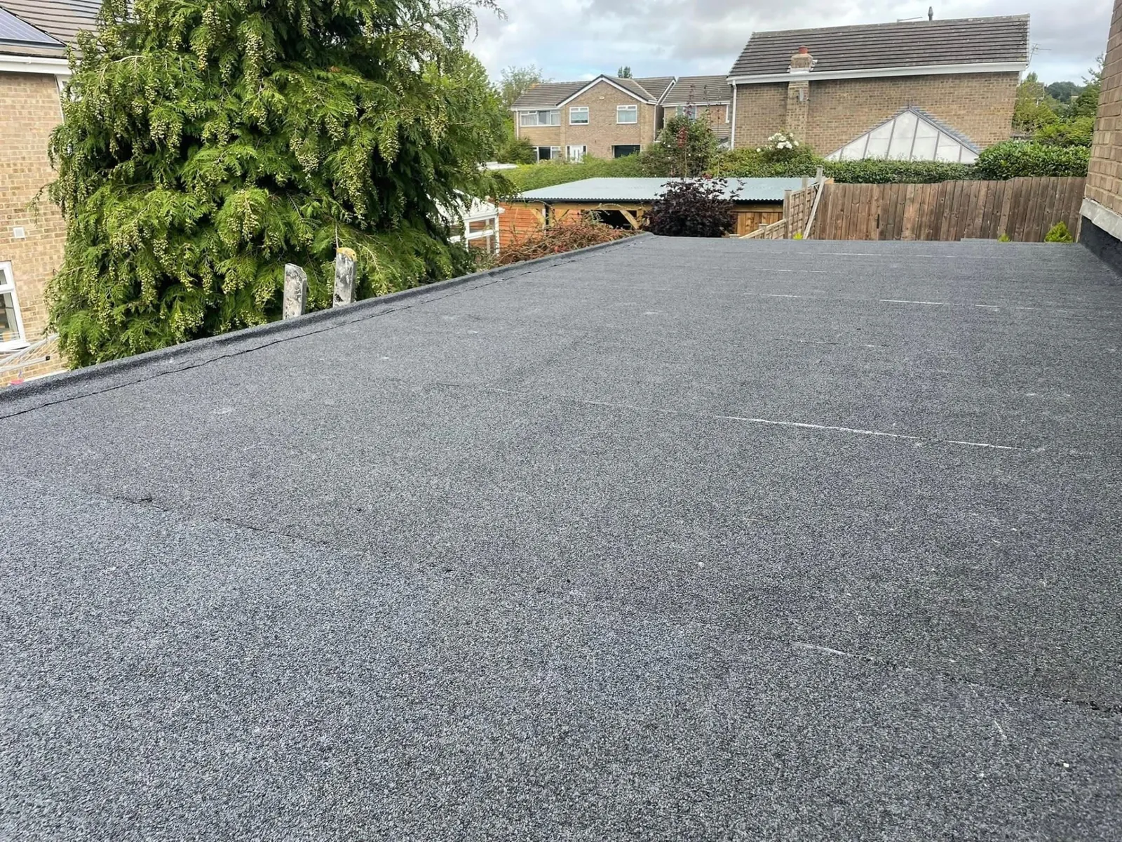 Newly installed mineral felt flat roof on a house extension
