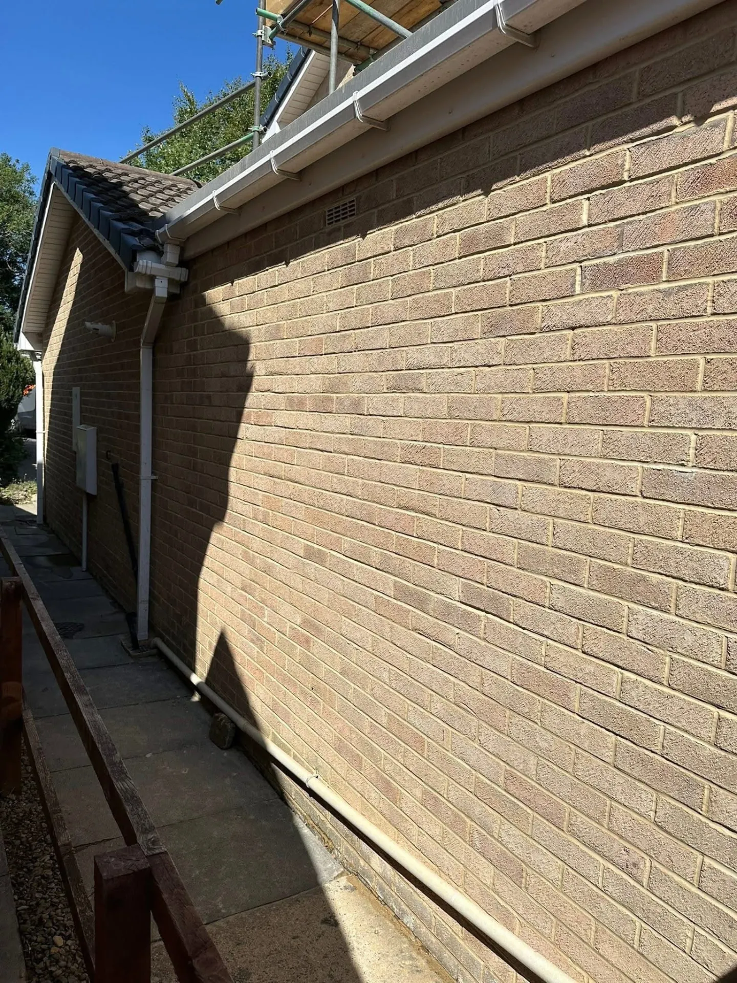 Repointed brickwork on a house wall with neat new mortar joints