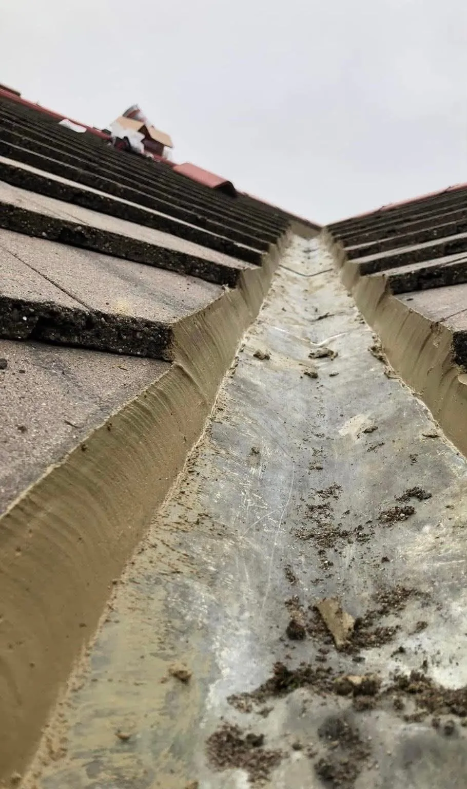 Roof valley with freshly repointed mortar and lead valley lining