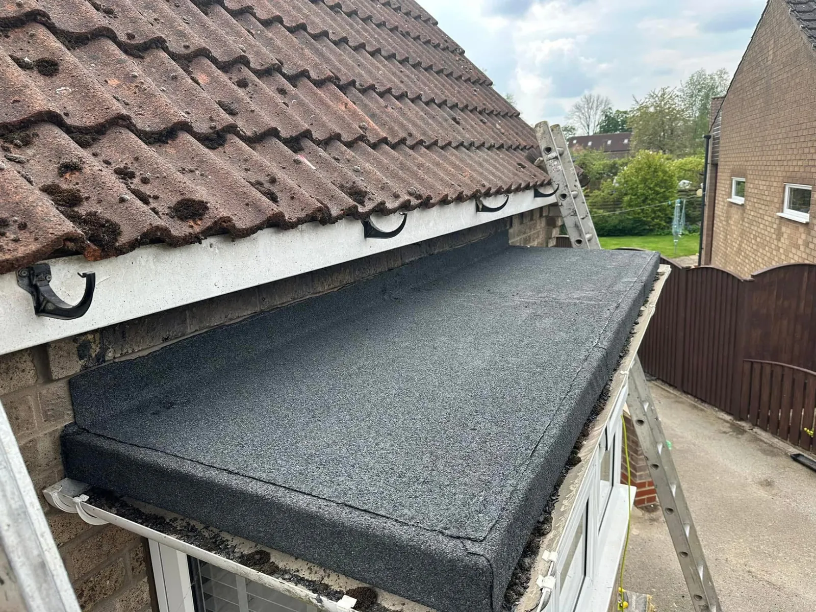 New felt flat roof over a bay window with neat dressed edges